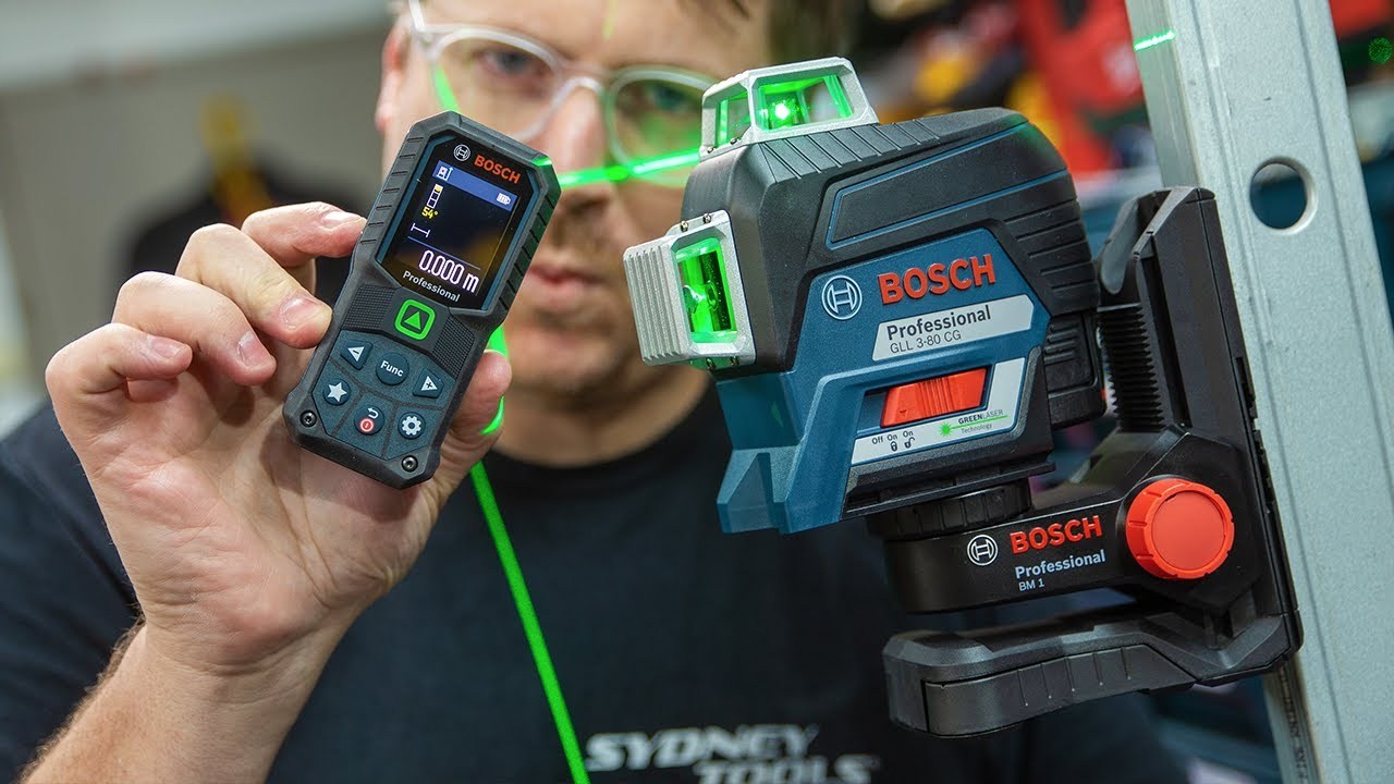 An image of a professional using a Bosch laser level .