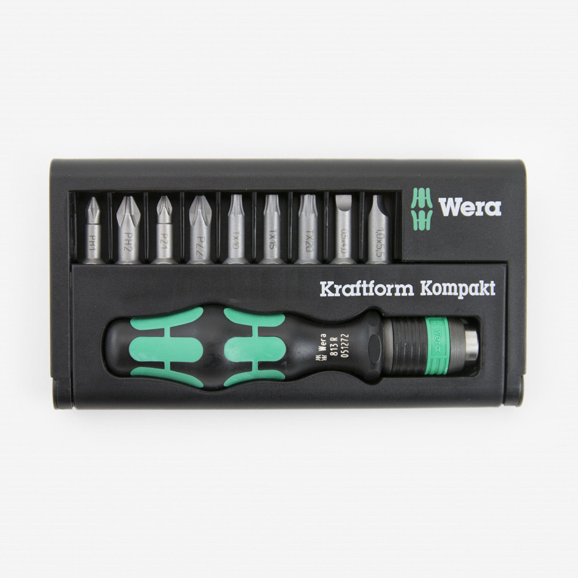 Wera - 5056653001 KK 10 Compact Bitholder and Bit Set, 10-Piece: This image shows a black plastic case containing a set of screwdriver bits and a handle. The handle, which is black with two green stripes, lies horizontally at the bottom of the case, and above it are ten silver-colored screwdriver bits arranged in a row. The brand name "Wera" is visible in white letters on the right side of the case.
