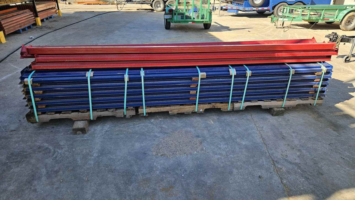 A wide-angle product photograph of multiple 12-foot industrial teardrop pallet rack step beams stacked on a wooden pallet, featuring a heavy-duty blue finish and a 4.5-inch face height for professional long-span warehouse storage racking.