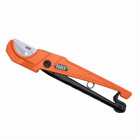 A Klein Tools 14-inch pruning saw with an orange handle, black lever, and silver metal blade, shown on a solid white background.