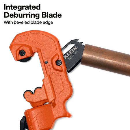 An orange and black Kleen pipe cutter shown with a copper pipe, with text reading 'Integrated Deburring Blade' and 'With beveled blade edge' on a white background.
