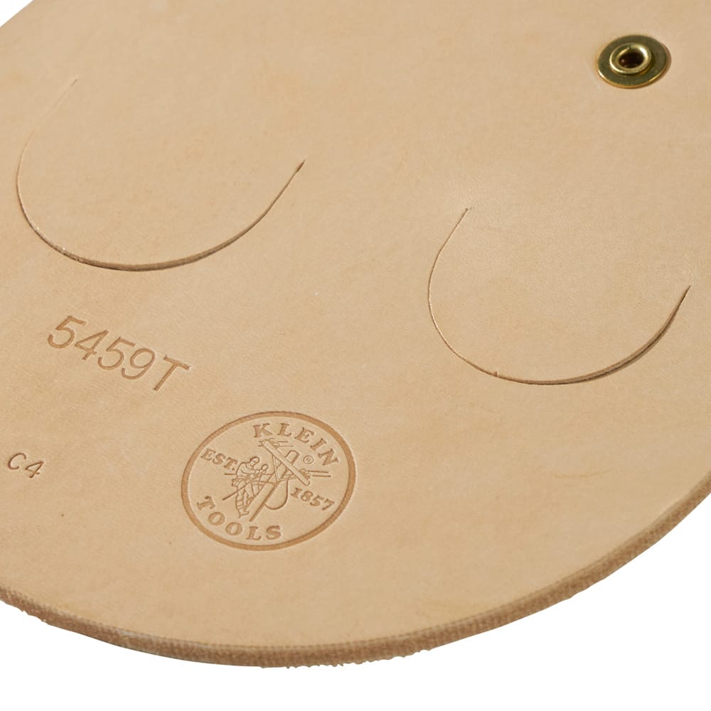 Close-up view of the Klein 5459T leather body showing stamped model markings, dual die-cut tool slots, and heavy-duty structural rivets.
