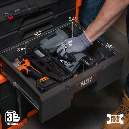 An open black and orange modular tool drawer organizer filled with power tools, shown with overlaid dimension labels and a gloved hand reaching in. Visible branding includes Klein Tools on the drawer front and a 3-Drawer logo in the corner.