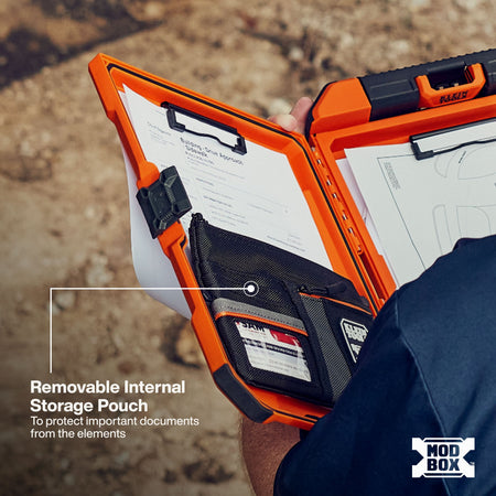 An open orange and black MOD BOX document storage case being held by a person outdoors. The case has built-in document pockets, clips, and a removable internal storage pouch, with text overlay explaining the storage pouch feature.