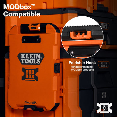 Close-up of an orange and black Klein Tools tool box with text reading 'MODbox Compatible' and a circular inset showing a foldable hook attachment point.