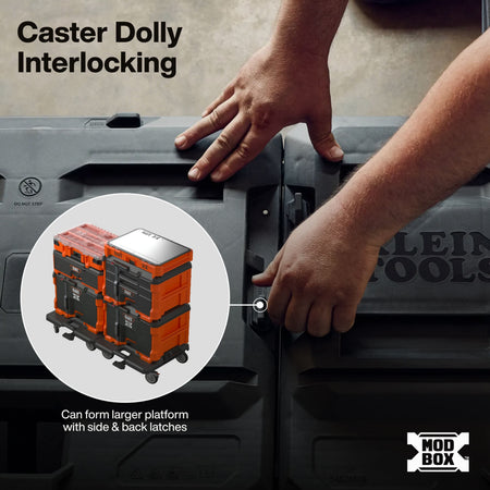 Close-up of a person's hands demonstrating the interlocking caster dolly feature on a gray modular tool box. A circular inset shows stacked orange and gray tool boxes on casters.