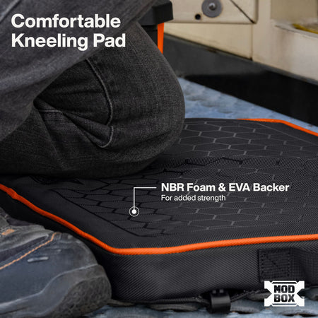 A close-up of a black kneeling pad with orange trim being used by a person, shown with text overlays reading 'Comfortable Kneeling Pad' and 'NBR Foam & EVA Backer For added strength.' A MOD BOX logo appears in the bottom right corner.