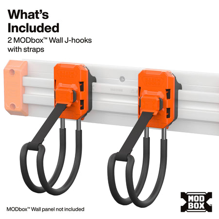 Two orange MODbox wall J-hooks with black hanging straps mounted on a white wall panel, with text reading 'What's Included' and '2 MODbox Wall J-hooks with straps'.