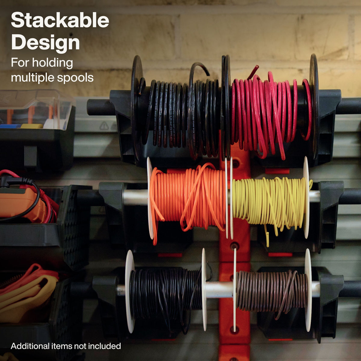 A stackable wire spool holder mounted on a wall, holding multiple colored spools of wire. The product includes black, red, orange, yellow, and brown spools on a red and black rack system.