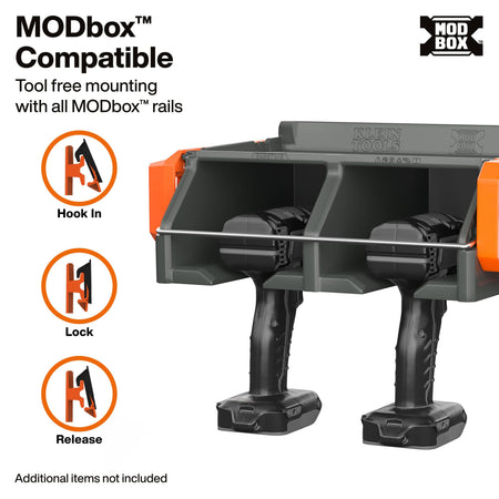 A pair of black cordless tools mounted in a gray dual-compartment tool tray with orange side accents, shown on a white background with text and icons explaining MODbox compatibility and hook-in, lock, and release function.