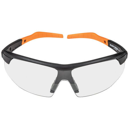Safety glasses with orange and black frame on a white background
