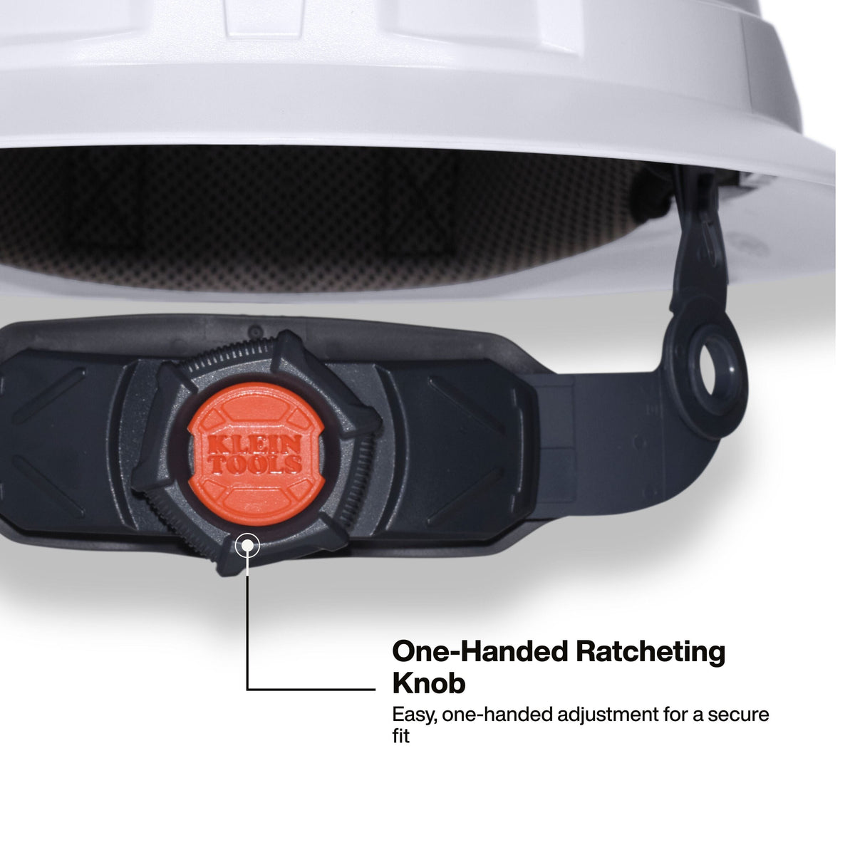 Close-up of a black hard hat chin strap with an orange Klein Tools ratcheting knob, shown with a white hard hat above and text reading 'One-Handed Ratcheting Knob' and 'Easy, one-handed adjustment for a secure fit.'.
