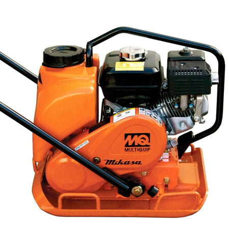  Running your hands over the heavy, flat base. Above it, you can feel the distinct shapes of the engine, including a fuel tank with a cap and a section with cooling fins. The curved handle extends upwards for maneuvering. You'd also feel the raised "MQ Multiquip" and "Mikasa" logos on the side, confirming the brand. This feels like a powerful, vibrating tool for compacting ground.
