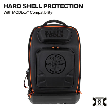 A black hard-shell backpack with orange piping and embossed branding, shown on a white background with text reading 'HARD SHELL PROTECTION With MODbox Compatibility' and an MODbox logo.