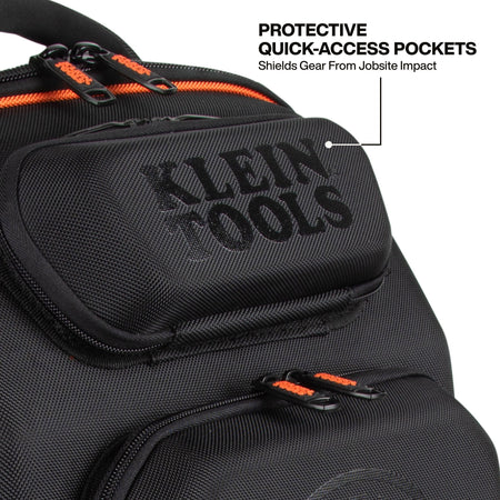 Close-up of a black Klein Tools backpack or gear bag with orange zipper pulls and a text callout reading 'PROTECTIVE QUICK-ACCESS POCKETS Shields Gear From Jobsite Impact.' The main visible product area is the front pocket with embossed Klein Tools branding.