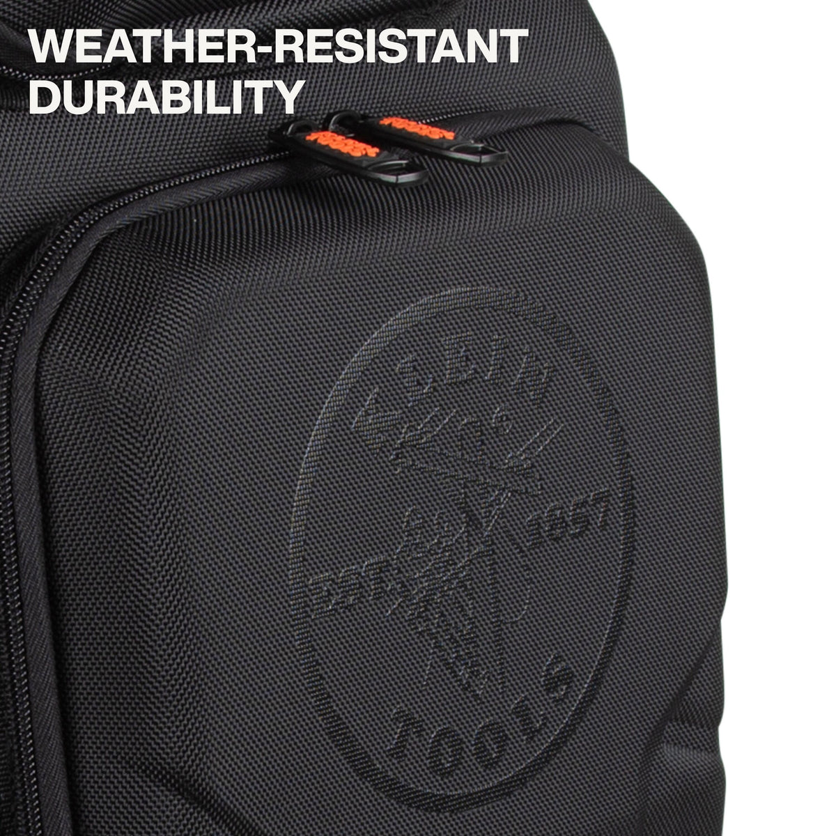 Close-up of a black textured backpack or bag with a front zip pocket, orange zipper pulls, and embossed circular branding. White text in the top left reads 'WEATHER-RESISTANT DURABILITY'.