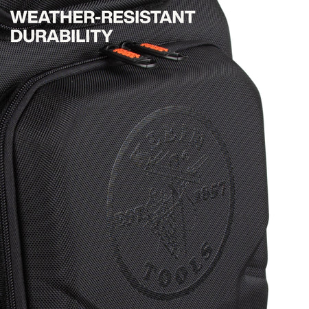 Close-up of a black textured backpack or bag with a front zip pocket, orange zipper pulls, and embossed circular branding. White text in the top left reads 'WEATHER-RESISTANT DURABILITY'.