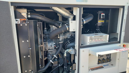 Engine campartment open with the opperating controlls visiable.