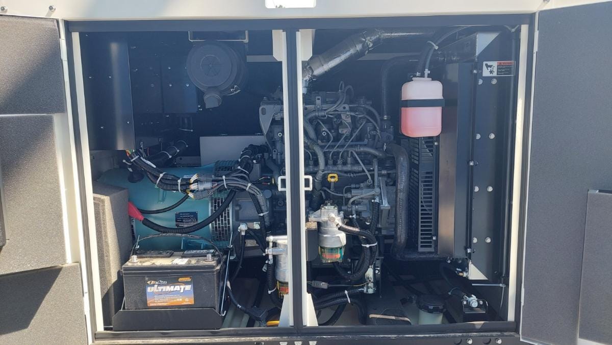 MultiQuip 45kVA Single/Three-Phase Mobile Generator DCA45SSIU4F engine and internal components view with open metal housing panel.