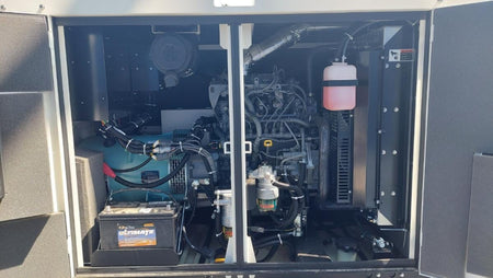 MultiQuip 45kVA Single/Three-Phase Mobile Generator DCA45SSIU4F engine and internal components view with open metal housing panel.