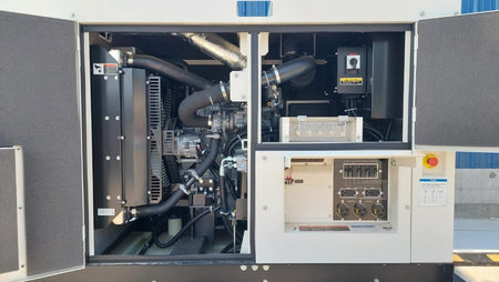 Picture of the doors open exposing the interior of the engine compartment, aswell as the control panel.