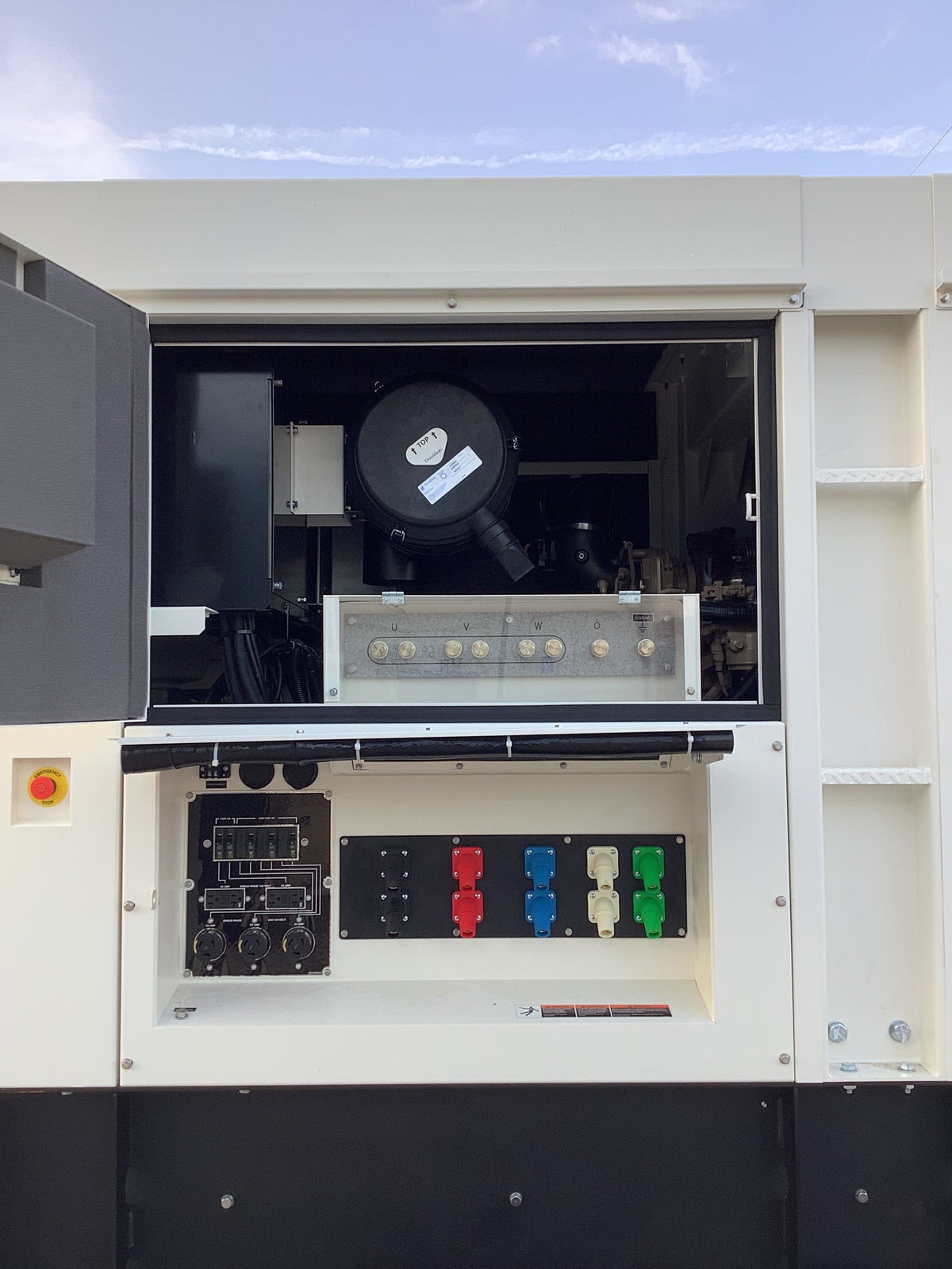 Picture of the controll panel door open, showing the controllc, and air filted access.