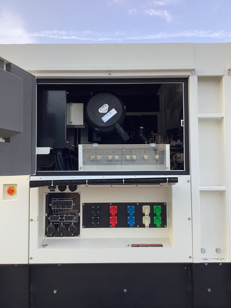 Picture of the controll panel door open, showing the controllc, and air filted access.