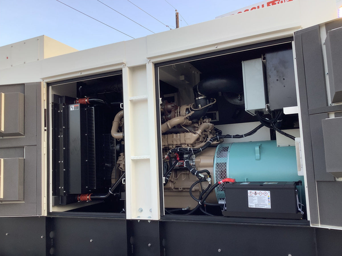 Left side of trailer mounted generator, Door open showing the cotroll panel and engine compartmet.