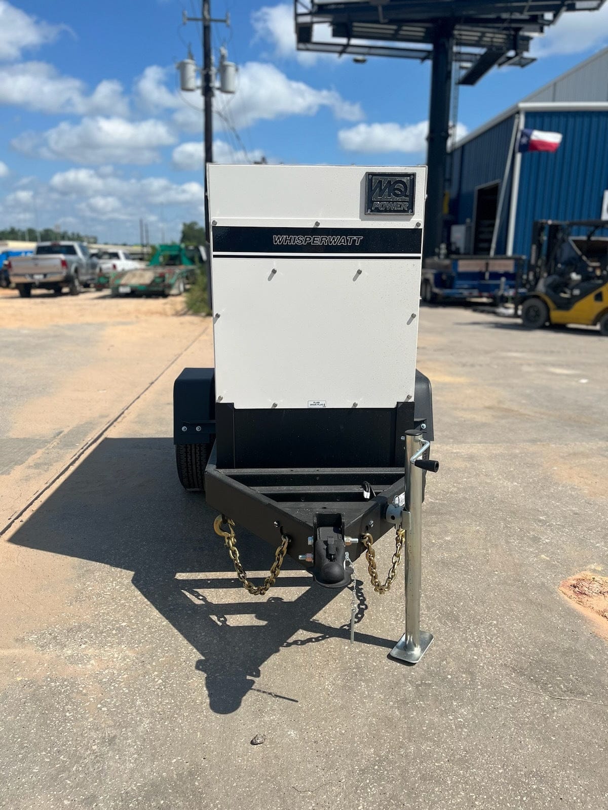 Front view of generator on the trailer, showing the hitch and chains , aswell as the jack.
