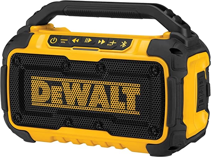 DeWalt Bluetooth Speaker. The image shows a black and yellow DeWalt DCR010 jobsite Bluetooth speaker. It has a cylindrical body with a yellow roll cage and a black control panel on top.