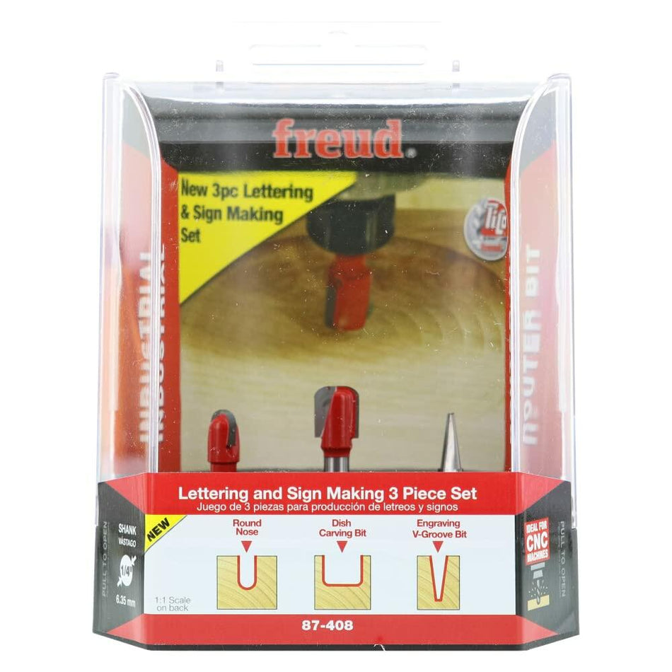 Retail packaging for the Freud 3-piece Lettering and Sign Making Router Bit Set, illustrating the three bit profiles: Round Nose, Dish Carving Bit, and Engraving V-Groove Bit.