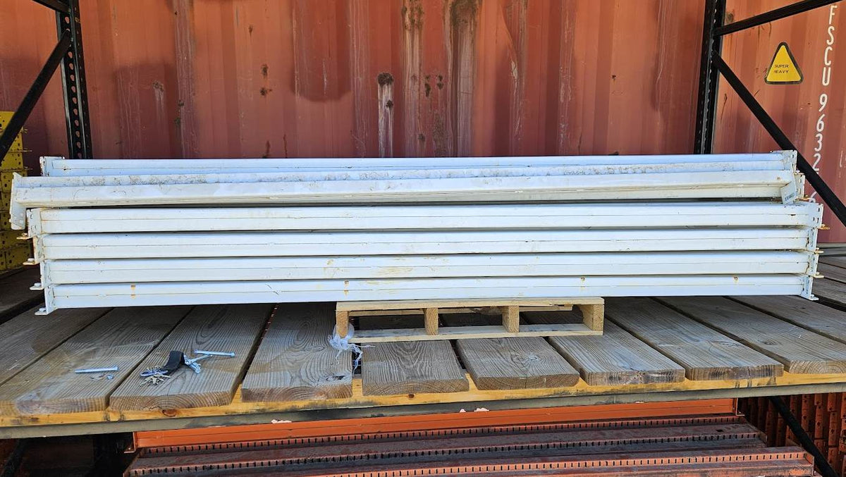 A stack of industrial 8-foot teardrop pallet rack step beams in used condition, featuring a professional white finish and a 3.5-inch face height for heavy-duty 96-inch warehouse storage racking.