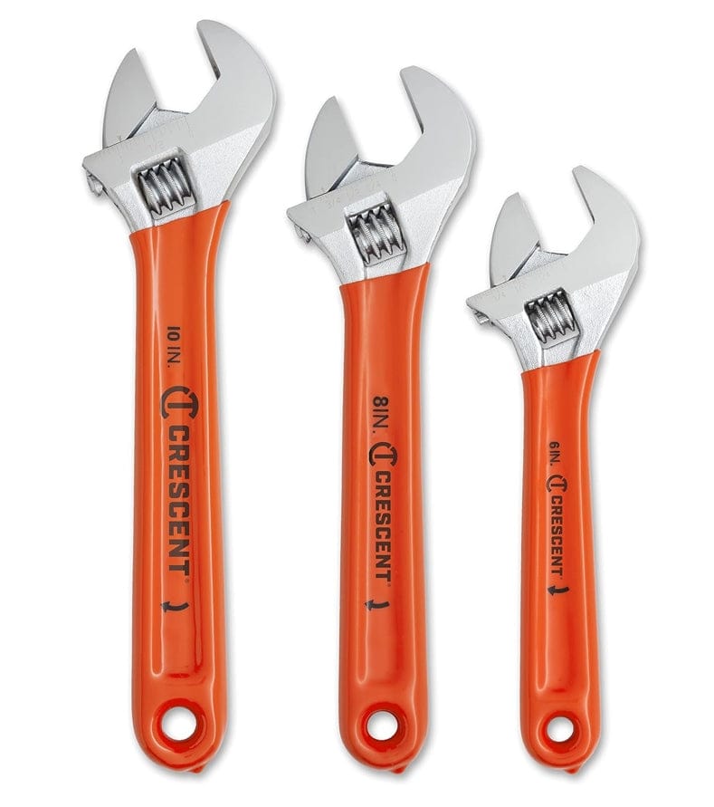 A vertical studio shot of the three Crescent adjustable wrenches (10-inch, 8-inch, and 6-inch) with orange handles, standing upright to show their full size variation on a white background.