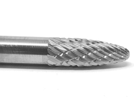 A close-up macro shot of the double-cut (cross-cut) flutes on the head of the UCT Gem Carbide SF-1 burr.