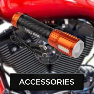 Flashlight with USB cable on a motorcycle engine, labeled 'Accessories'.