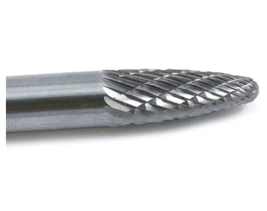 A close-up macro shot of the double-cut (cross-cut) flutes on the head of the UCT Gem Carbide SL-1 burr.