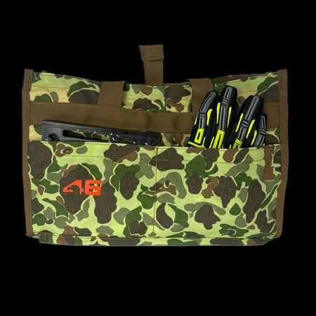 Atlas 46 Quick Tool Bag exterior pockets holding a rafter square and work gloves to demonstrate organized tool access for contractors.