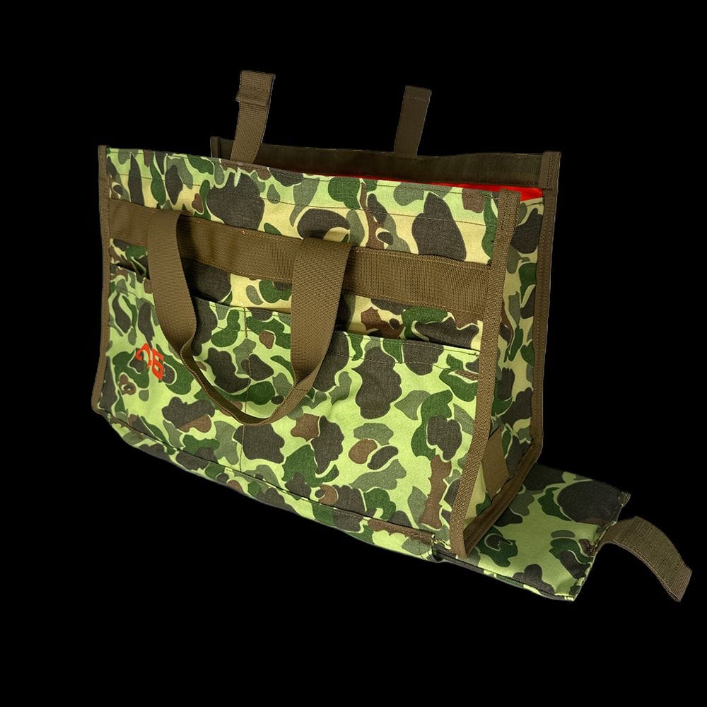 Atlas 46 Quick Tool Bag side profile highlighting the bottom-access compartment where the padded kneeling mat slides out for floor work.