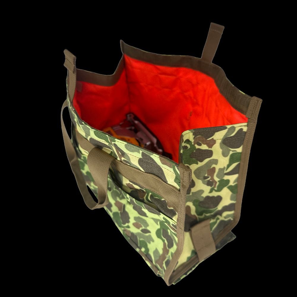 Atlas 46 tool tote open top view displaying a power tool inside the hi-vis orange interior liner engineered for low-light visibility.