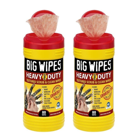 Two bright yellow tubs of Big Wipes Heavy-Duty Textured Scrub & Clean Wipes with red tops, showing wipes dispensing from each, and a graphic of dirty hands being cleaned.