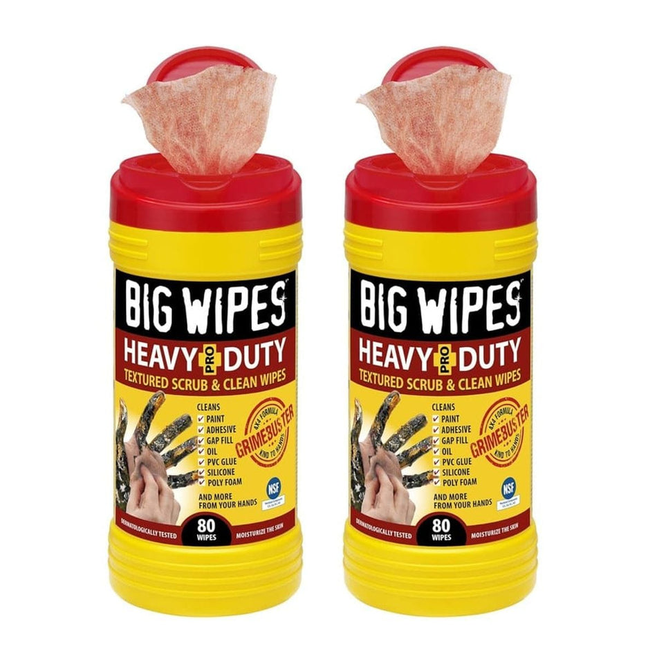 Two bright yellow tubs of Big Wipes Heavy-Duty Textured Scrub & Clean Wipes with red tops, showing wipes dispensing from each, and a graphic of dirty hands being cleaned.