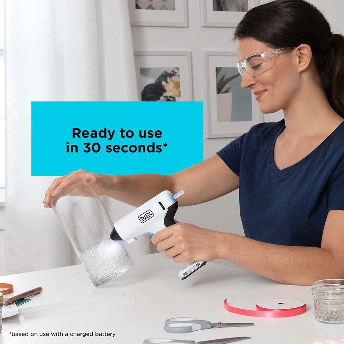 Crafter working on a decorative glass vase with the BLACK+DECKER 4V MAX cordless glue gun, with a graphic overlay stating ready to use in 30 seconds.