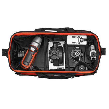 Top-down interior view of the high-capacity BLACK+DECKER multi-storage organizer fully loaded with various Matrix system power tool attachments and power units, showcasing the efficient use of rigid dividers and internal pockets for secure tool management.