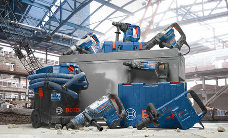 Bosch power tools on a construction site with a large storage container.