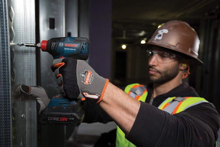 Construction worker using a Bosch GDX18V‑1800C reconditioned 18V brushless impact driver with CORE18V battery to drive a screw into a metal frame, showcasing jobsite durability, precision, and connected‑ready performance.