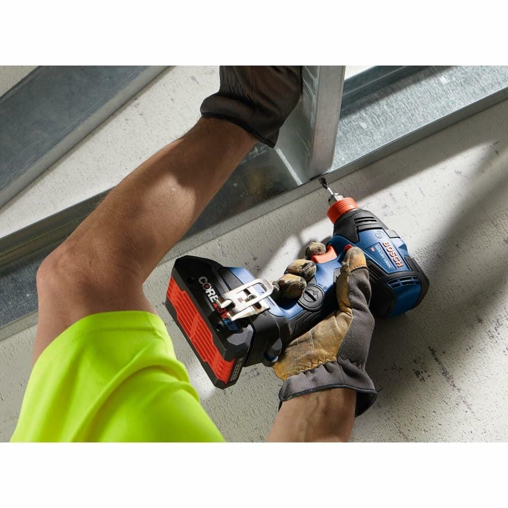 Bosch GSR18V-400B22 cordless drill being used to fasten a screw into a metal HVAC duct. The user wears gloves in an industrial setting, showcasing the drill’s compact design and versatility.