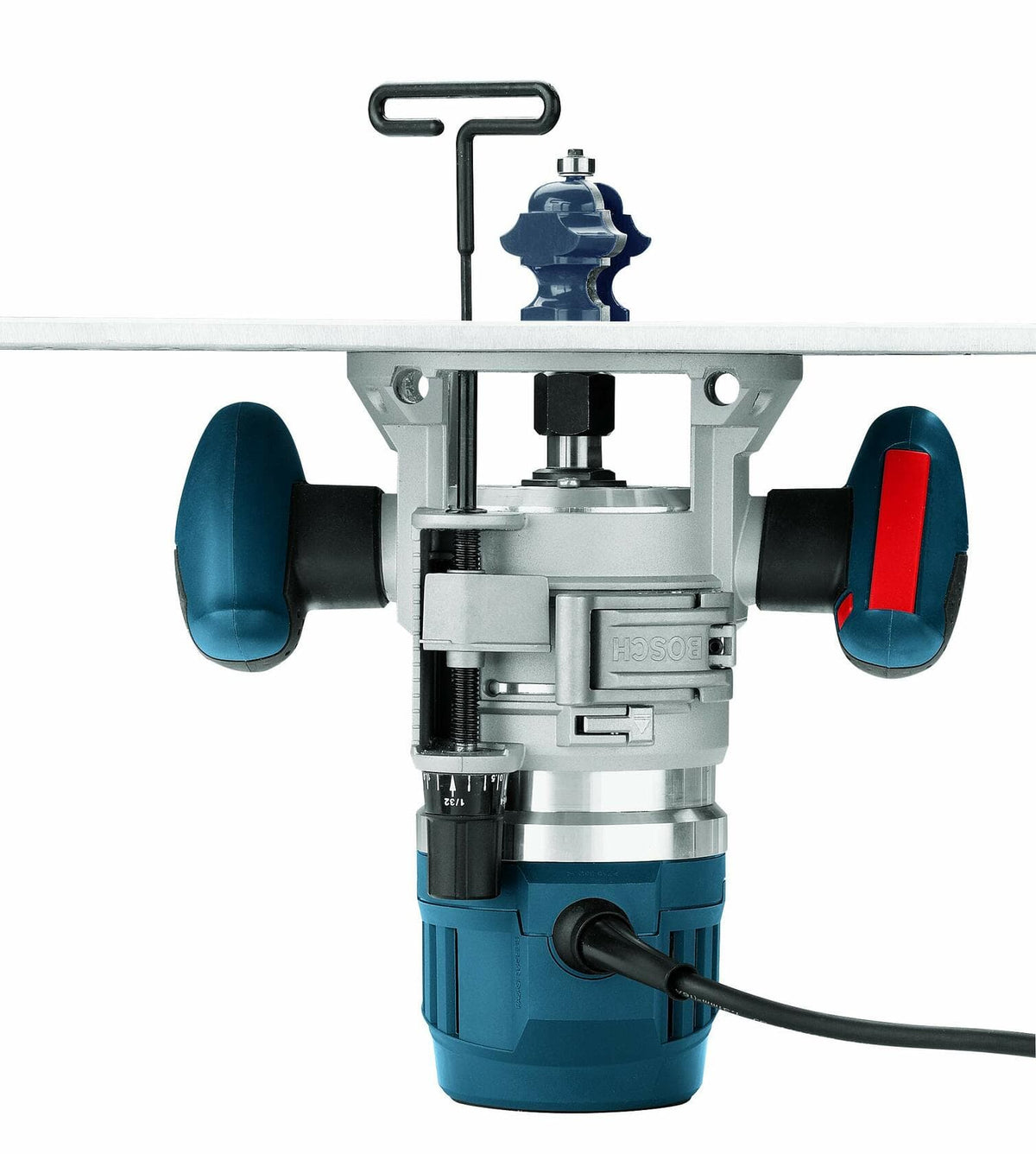 Bosch MRF23EVS router mounted under a router table with the bit protruding through the surface. A T-handle wrench is inserted for height adjustment. The cylindrical motor housing and ergonomic handles are visible.