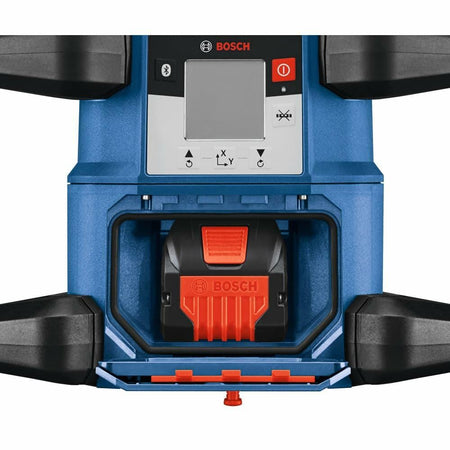 Close-up view of the Bosch REVOLVE4000 laser unit with an 18V CORE18V battery inserted into the front-facing battery compartment.