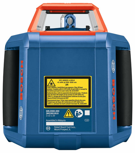 Close-up of Bosch GRL2000-40H rotary laser level with blue body and red top. A yellow label displays safety and laser specifications. The device includes a top handle and front control panel for operation.