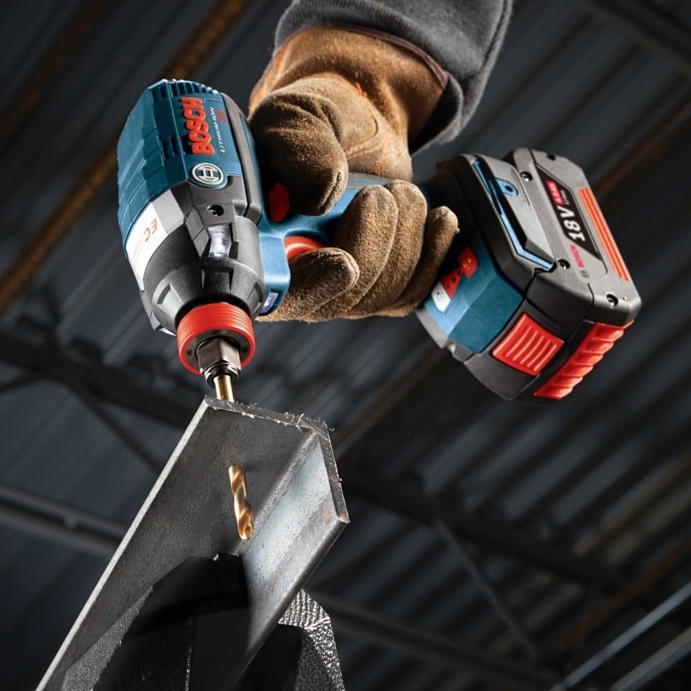 Action shot of a Bosch titanium drill bit boring through heavy-gauge angled structural steel using a cordless impact driver to demonstrate the durability of the titanium nitride coating in high-heat metal applications.